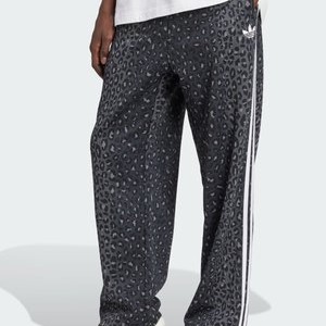 UNISEX - Tracksuit bottoms - black UNISEX - Tracksuit bottoms - black